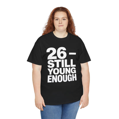 Person wearing a black t-shirt with '26 - STILL YOUNG ENOUGH' text on a white background