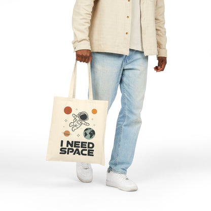 Space-themed astronaut illustration with planets on a TEEZOCA tote bag