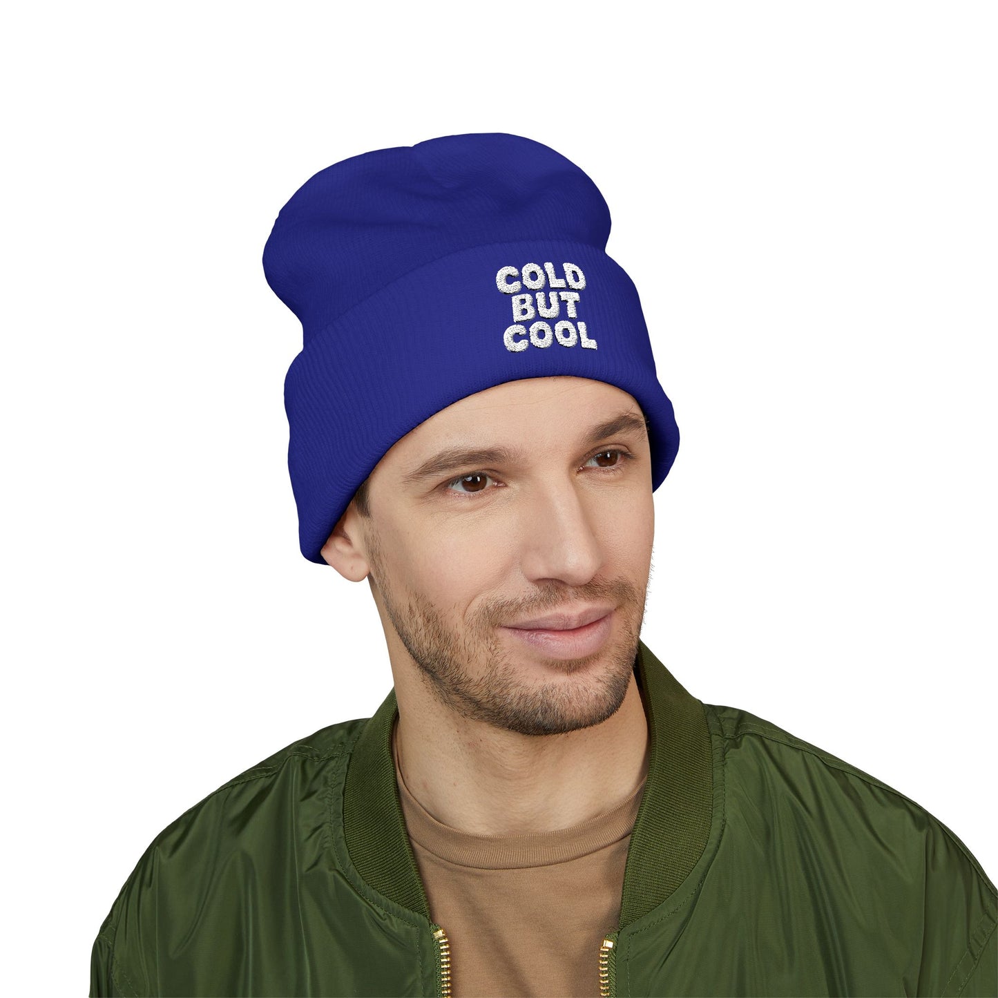 Man wearing a blue beanie with 'COLD BUT COOL' text on a white background