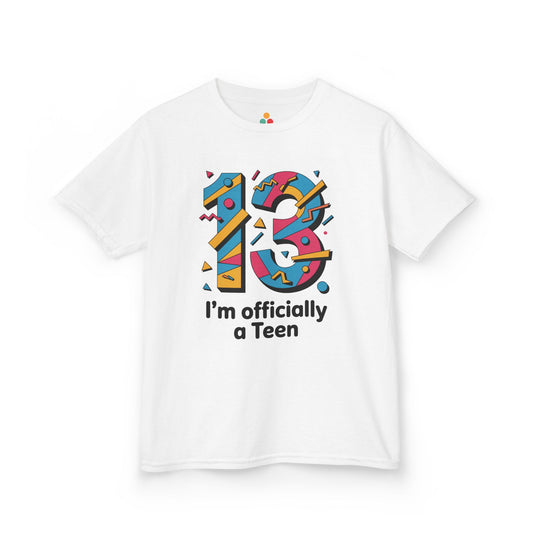 White t‑shirt with colorful geometric “13” and “I’m officially a Teen” text, flat front view.