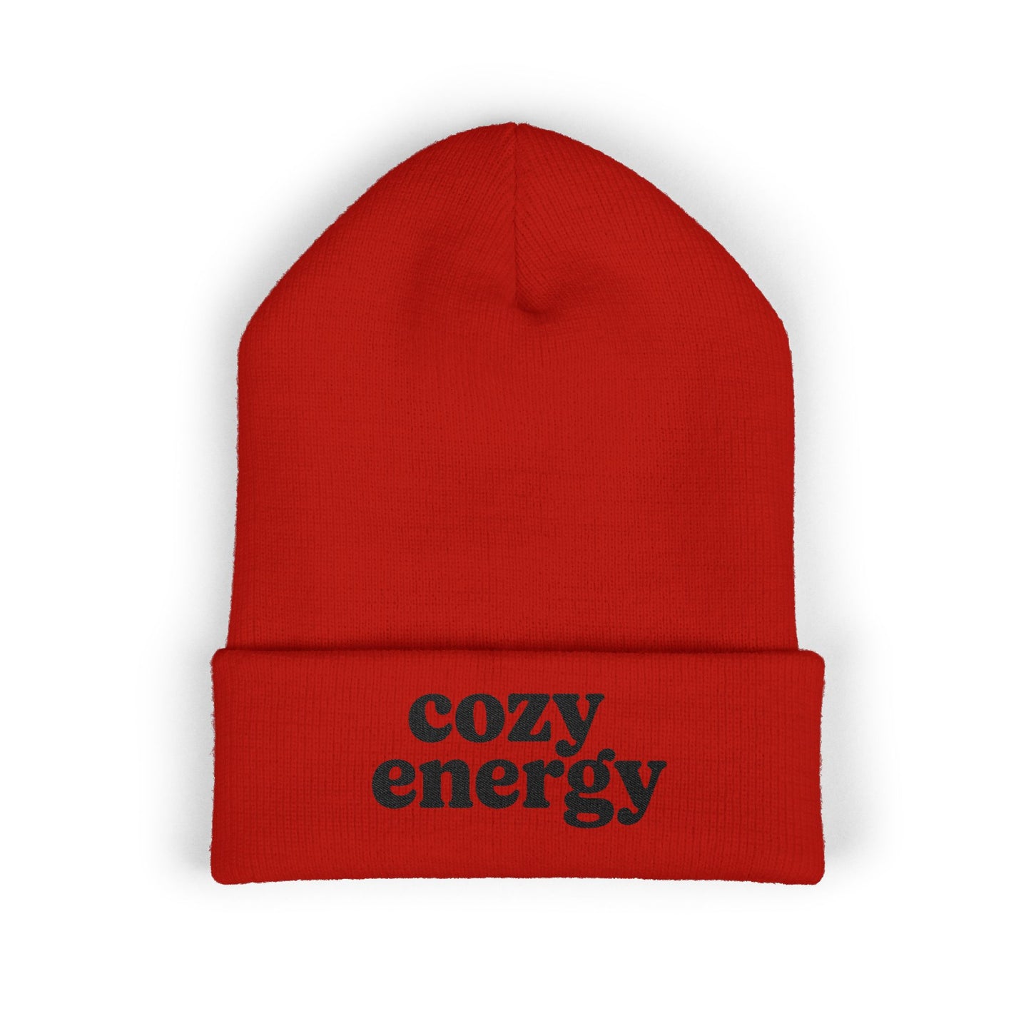 Red beanie with 'cozy energy' text on a white background