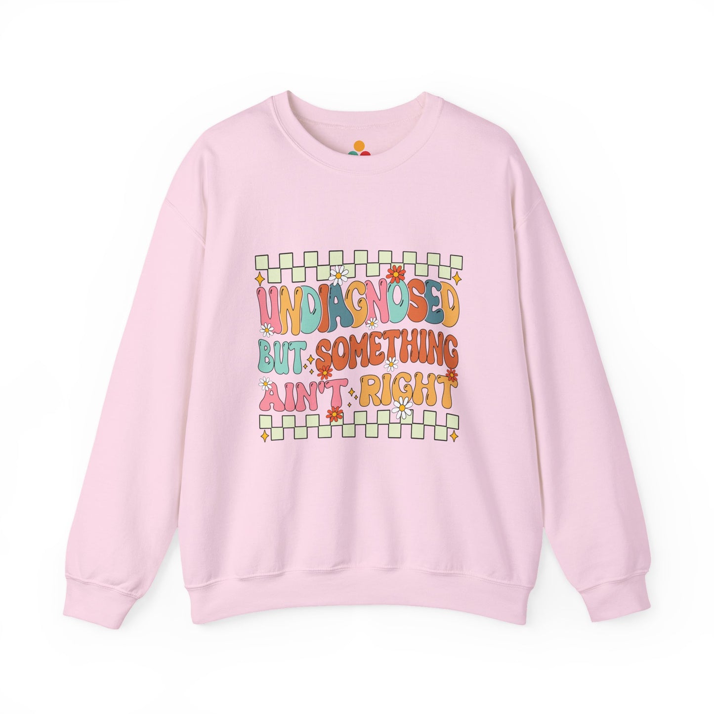 Pink sweatshirt with colorful text on a white background