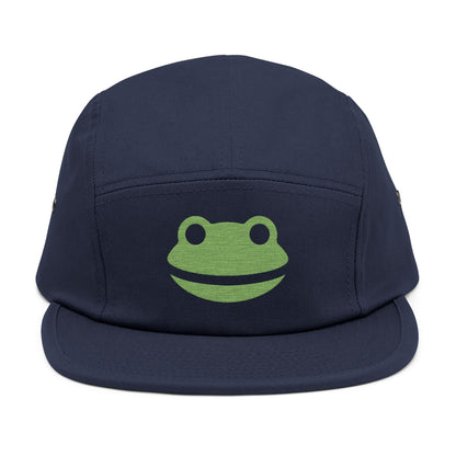 Navy blue cap with a green frog logo on a white background. Minimalist frog face embroidery design with wide smile and round eyes. TEEZOCA