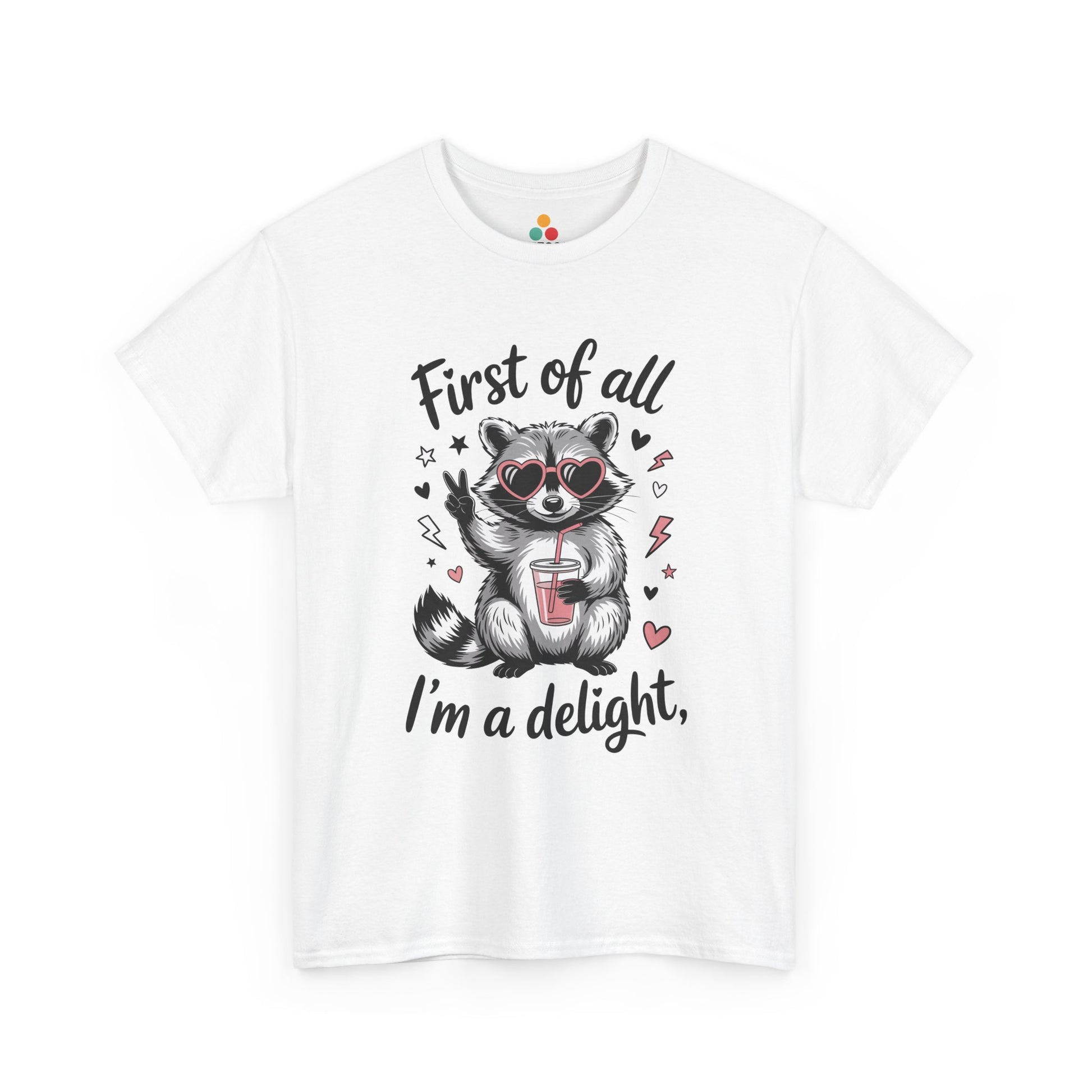 TEEZOCA white “First of all I’m a delight” raccoon with heart sunglasses t‑shirt shown flat.