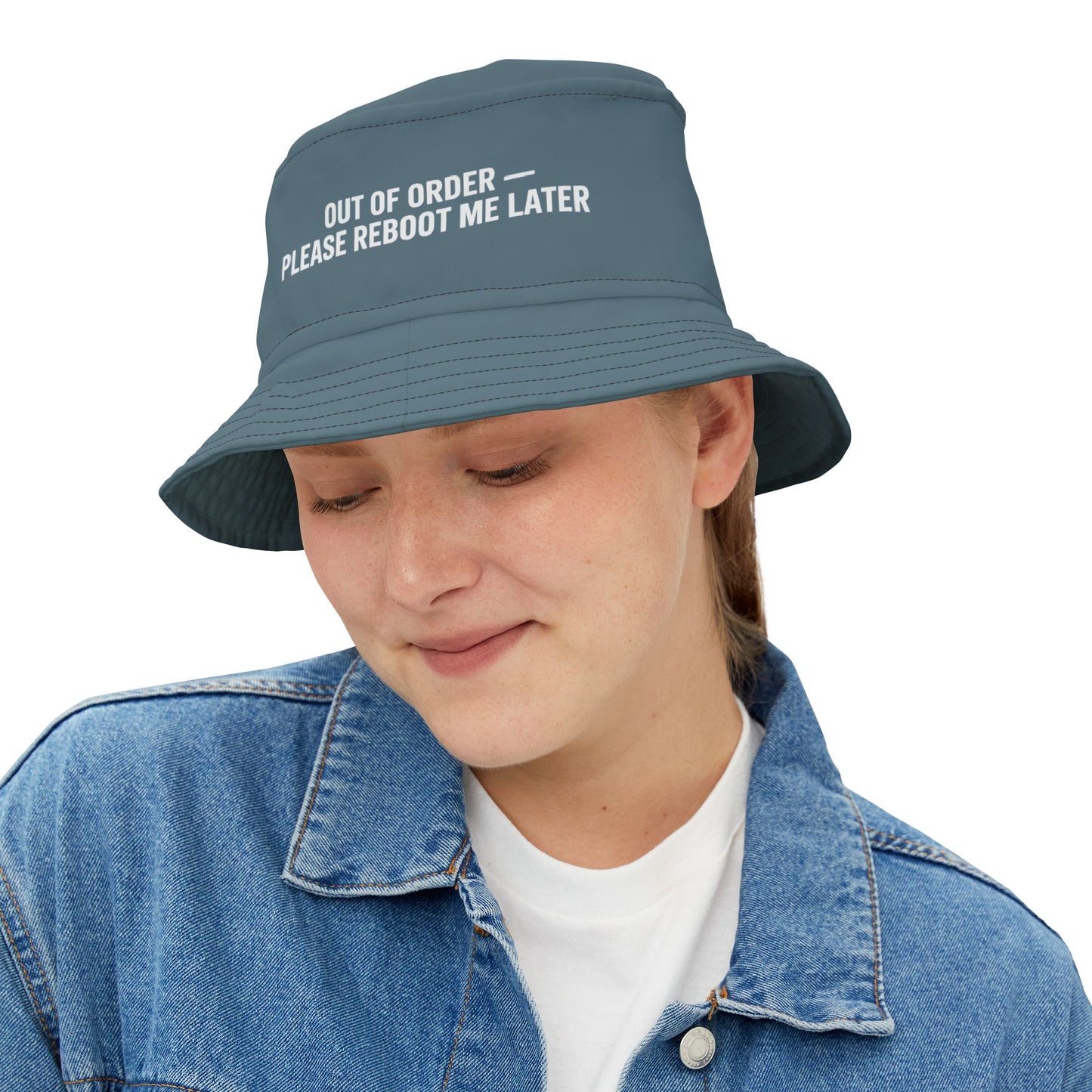 Funny blue bucket hat with text 'Out of order - please reboot me later' on a white background. TEEZOCA