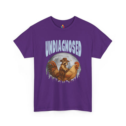 "Purple unisex t‑shirt with 'Undiagnosed' western graphic design and vintage raccoon cowboy illustration, flat front."
