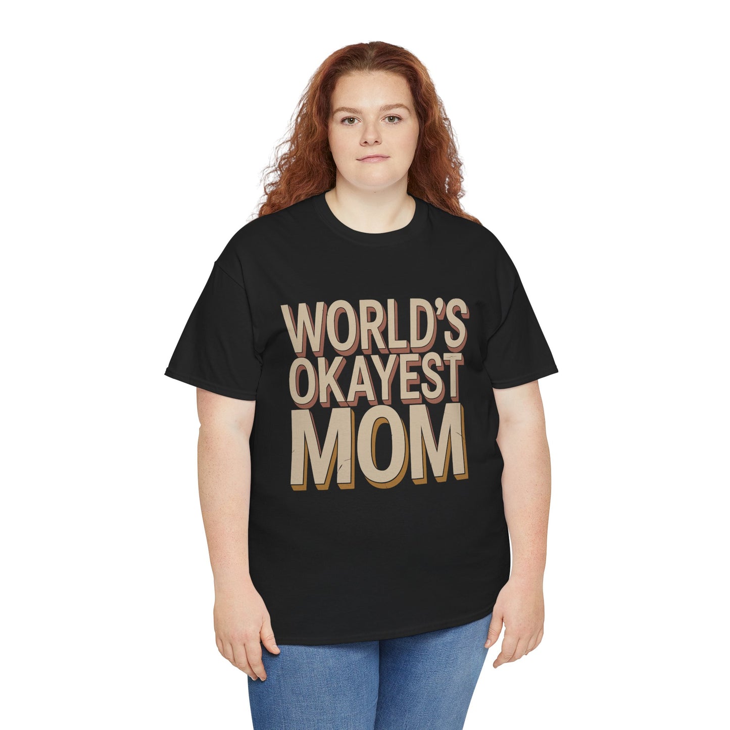 Woman wearing a black TEEZOCA “World’s Okayest Mom” funny mom t‑shirt.