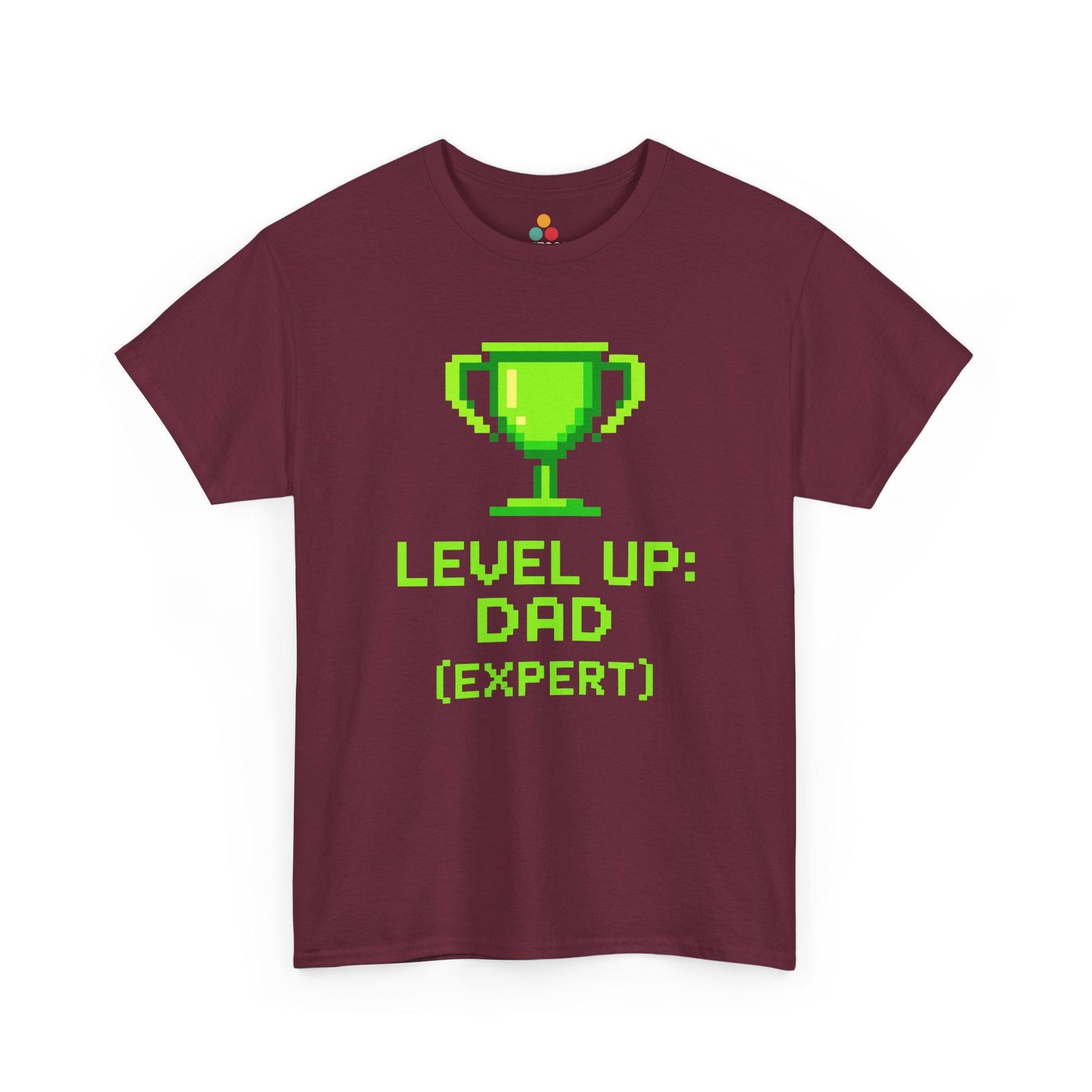 “Maroon gamer dad shirts featuring green pixel trophy and ‘Level Up: Dad (Expert)’ text, flat front view.”

