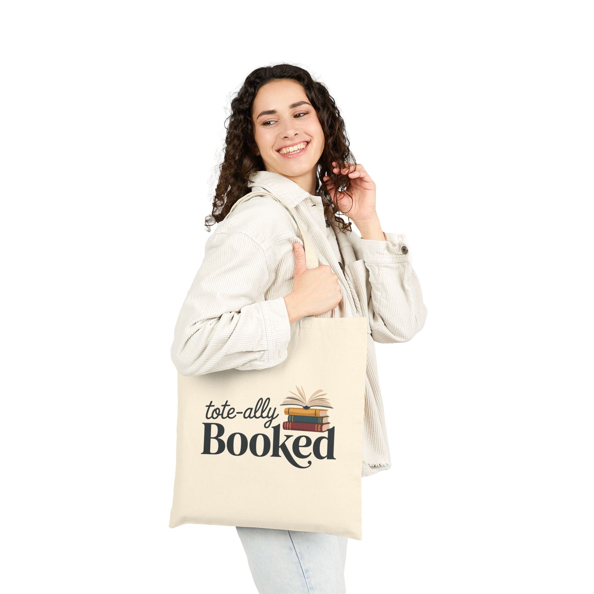 Literary-themed Totally Booked design with book stack on a TEEZOCA tote bag