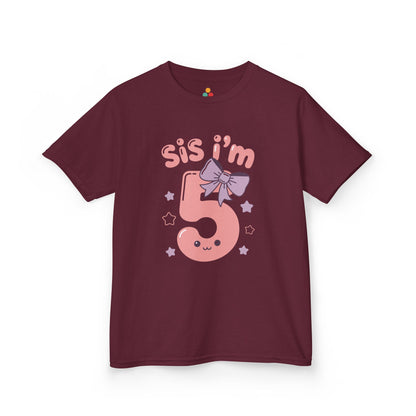 Burgundy kids' t‑shirt with pink "Sis I'm 5" design, bow, and stars, flat front view.