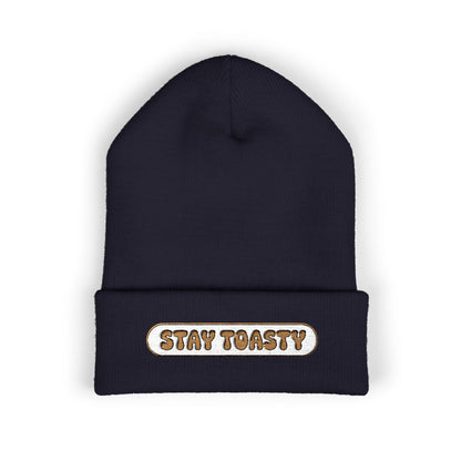 Black beanie with 'Stay Toasty' text on a white background