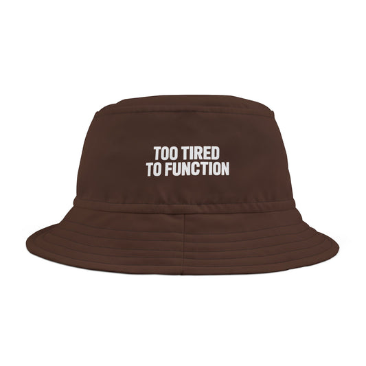 Funny brown bucket hat with 'Too Tired to Function' text on a white background. TEEZOCA