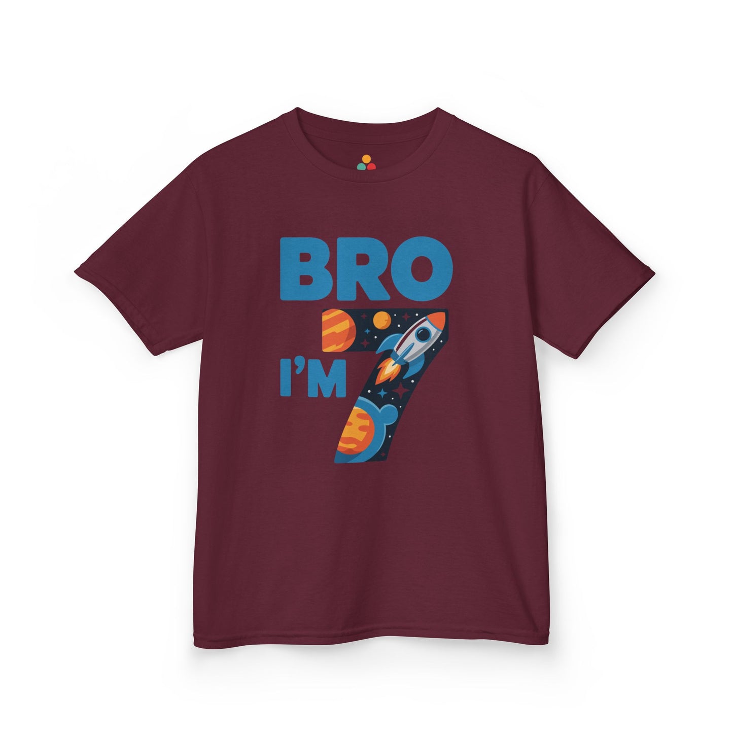 “Maroon ‘Bro I’m 7’ space rocket birthday shirt, bold blue lettering and number 7 full of planets and stars, flat lay.”

