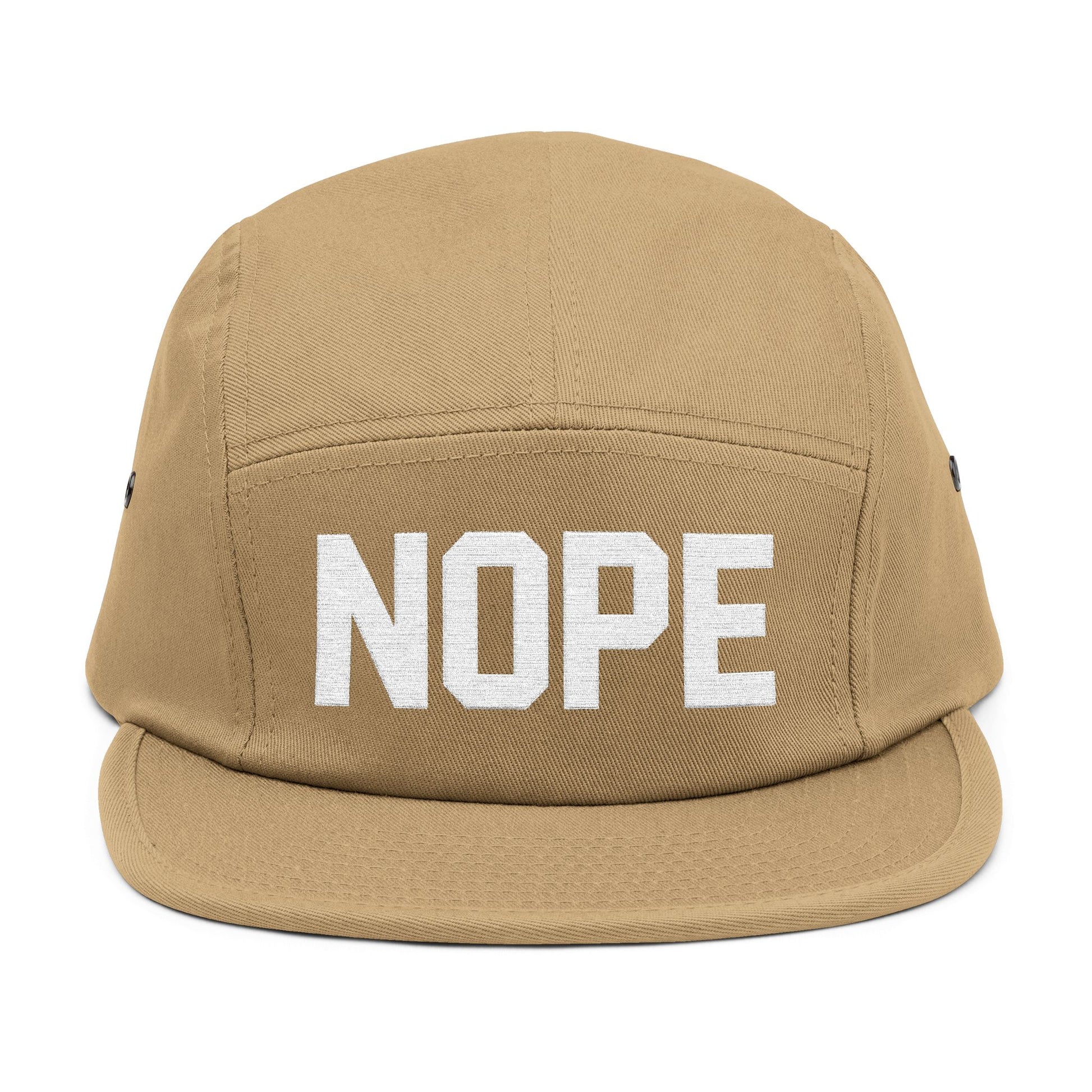 Beige cap with 'NOPE' text on a white background. NOPE bold minimal typography embroidery design on cap. TEEZOCA