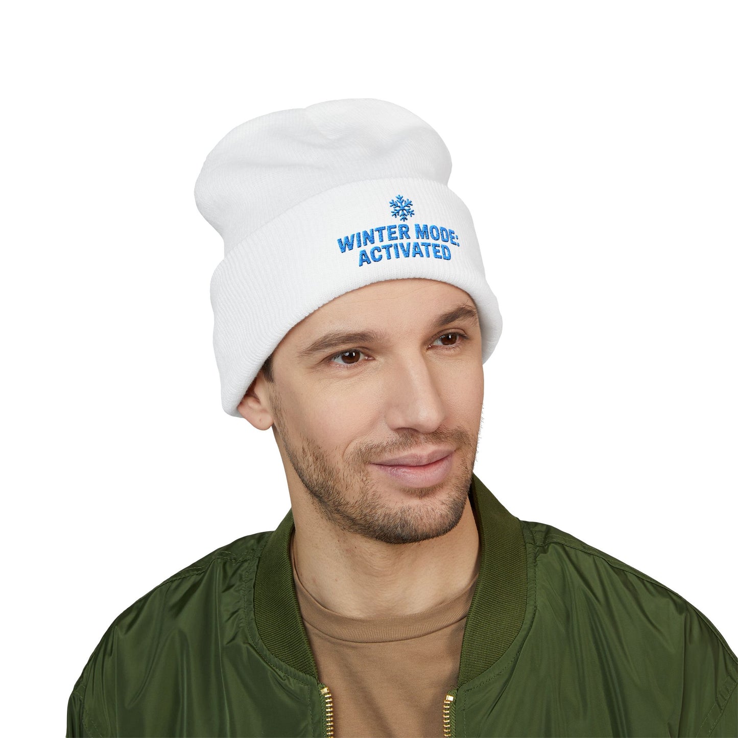Man wearing a white beanie with 'Winter Mode Activated' text on a white background. Winter snowflake embroidery beanie for cold-weather outfits