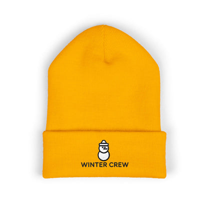Yellow beanie with 'Winter Crew' logo on a white background. Embroidered Winter Crew beanie with minimalist snowman icon on the cuff