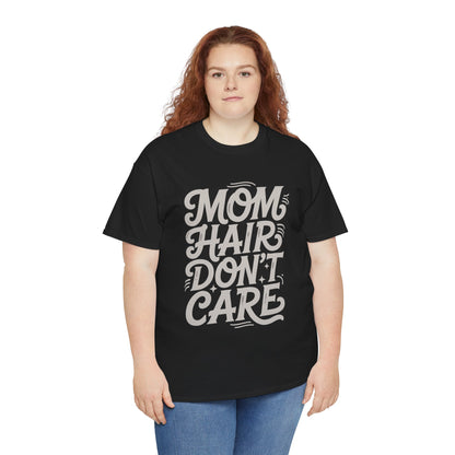 Woman wearing a black TEEZOCA “Mom Hair Don’t Care” funny mom tee with jeans.