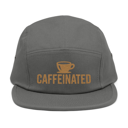 Gray cap with 'CAFFEINATED' text and coffee cup graphic on a white background. Caffeinated coffee cup icon embroidered design on five-panel cap. TEEZOCA