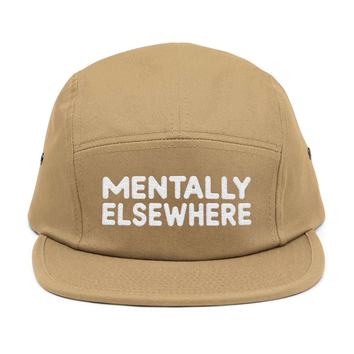 Beige cap with 'MENTALLY ELSEWHERE' text on a white background. Mentally Elsewhere embroidered text design on five-panel cap. TEEZOCA