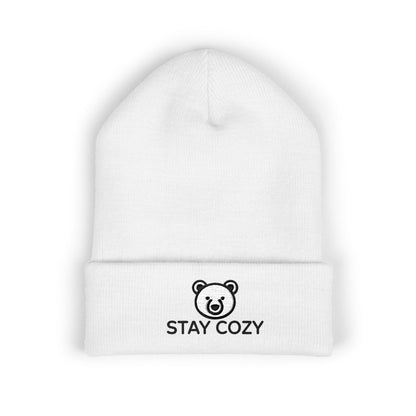 White beanie with 'STAY COZY' and bear logo on a white background