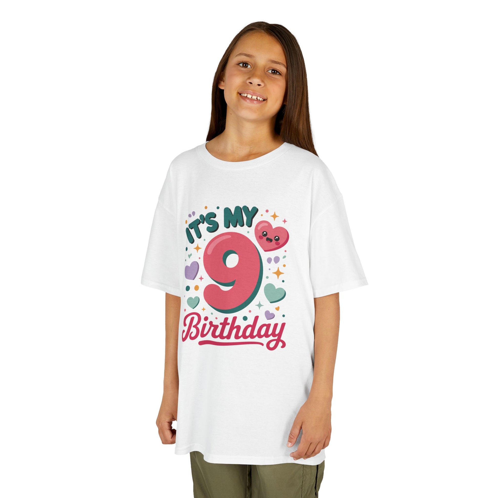 “Girl wearing white ‘It’s My 9th Birthday’ pink 9 and hearts shirt, fun kids birthday tee, front view.”

