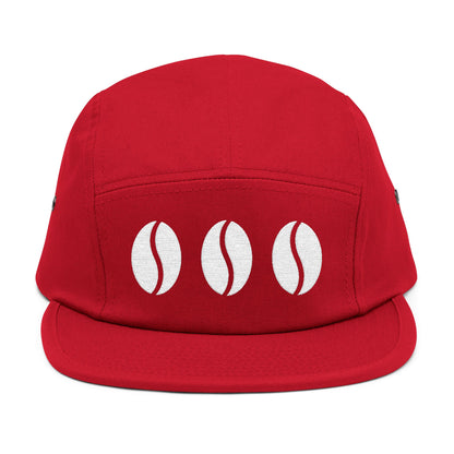 Red cap with three white coffee bean designs on a white background. Triple coffee bean minimalist embroidery on 5-panel cap. TEEZOCA