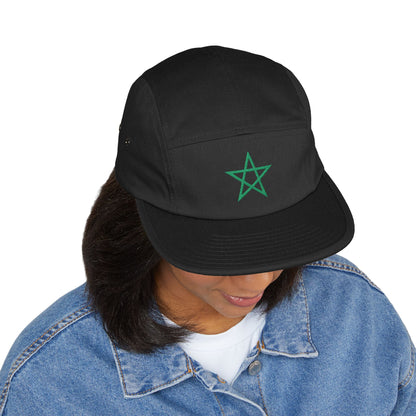 A woman looking down wearing a black TEEZOCA 5-panel Moroccan soccer supporter cap styled with a blue denim jacket.
