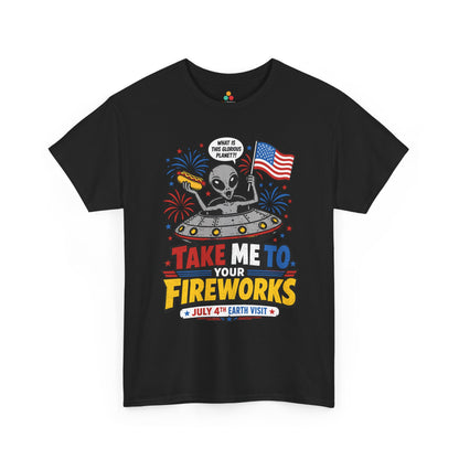 Alien shirt by TEEZOCA showing a funny gray alien in a flying saucer holding a flag and hot dog for 4th of July fireworks.
