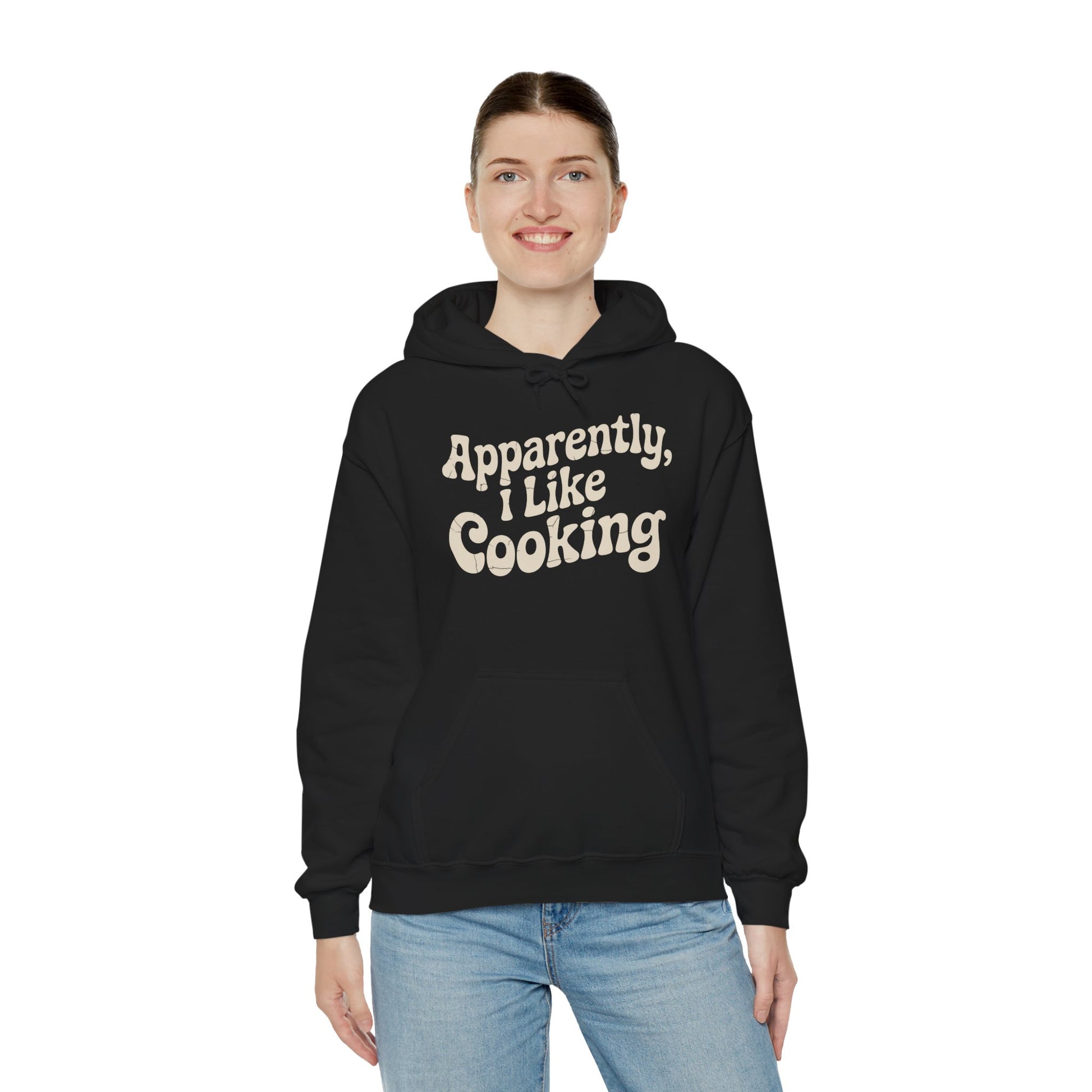 Apparently I Like Cooking Typography Unisex Heavy Blend Hoodie | TEEZOCA bold text humor Unisex Heavy Blend Hoodie everyday outfit vibe