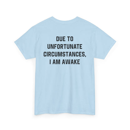 Back Print of a Light Blue T-shirt featuring bold black text reading "Due To Unfortunate Circumstances, I Am Awake," funny back print sarcastic quote shirt, not a morning person tee, dry humor graphic shirt, and blunt statement design.
