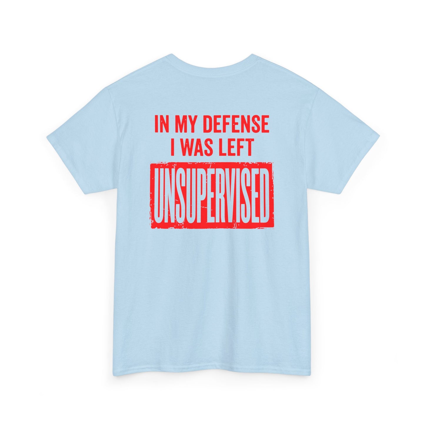 Back Print of a Light Blue T-shirt featuring the bold red and cream quote “In My Defense I Was Left Unsupervised,” a funny back print statement tee with retro typography, sarcastic quote shirt, witty adult humor graphic, dry humor novelty apparel, bold statement t-shirt, and playful sarcasm design for fans of funny quote shirts.
