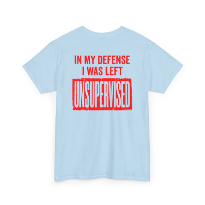 Back Print of a Light Blue T-shirt featuring the bold red and cream quote “In My Defense I Was Left Unsupervised,” a funny back print statement tee with retro typography, sarcastic quote shirt, witty adult humor graphic, dry humor novelty apparel, bold statement t-shirt, and playful sarcasm design for fans of funny quote shirts.
