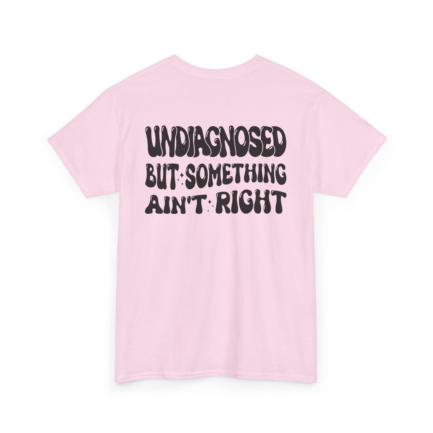 Back Print of a Light Pink T-shirt featuring the viral meme phrase "Undiagnosed But Something Ain't Right" in bold wavy retro typography, a trending funny mental health meme shirt, unhinged humor tee, therapy meme graphic, and relatable back print statement design.
