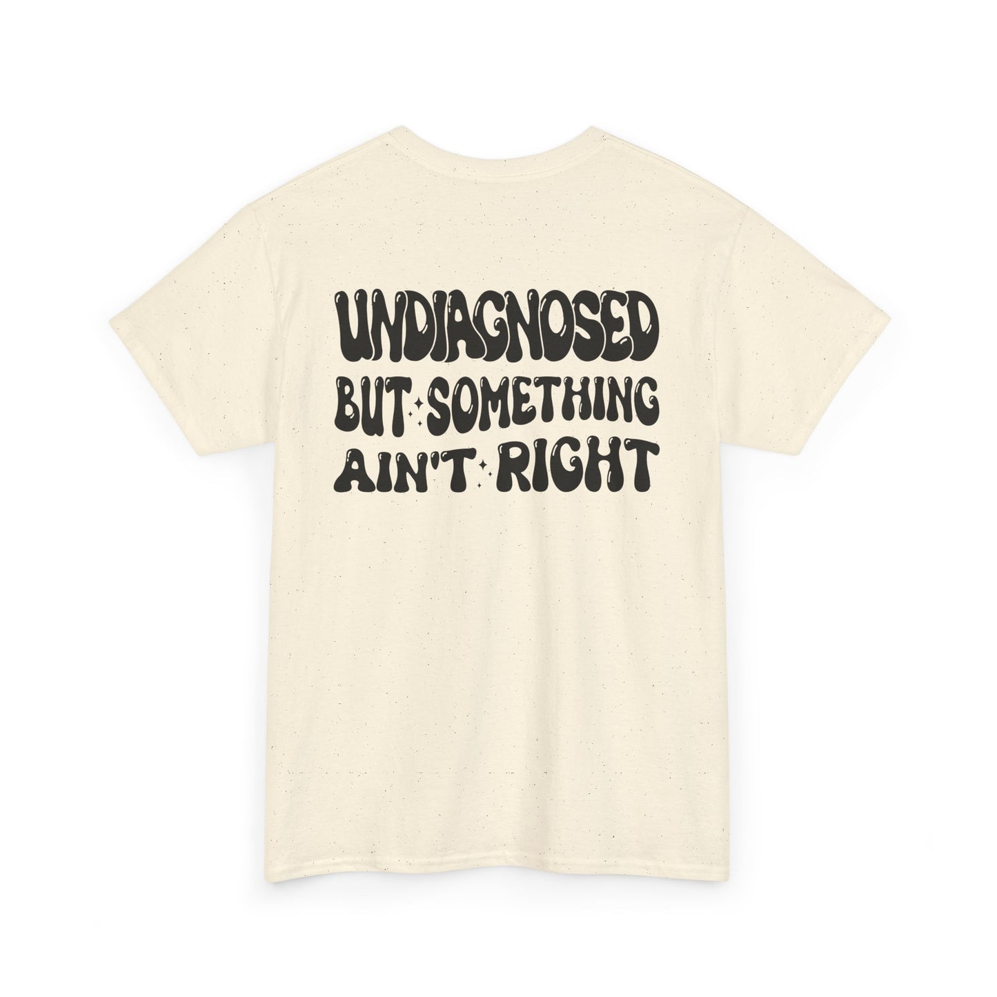 Back Print of a Natural T-shirt featuring the viral meme phrase "Undiagnosed But Something Ain't Right" in bold wavy retro typography, a trending funny mental health meme shirt, unhinged humor tee, therapy meme graphic, and relatable back print statement design.
