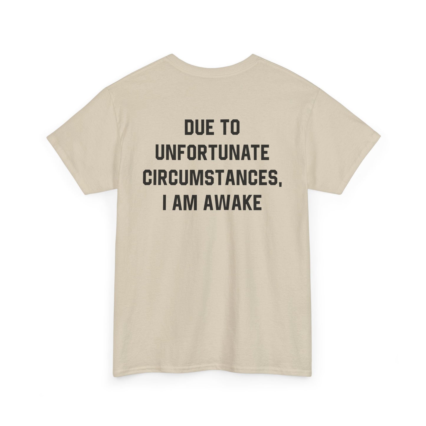 Back Print of a Sand T-shirt featuring bold black text reading "Due To Unfortunate Circumstances, I Am Awake," funny back print sarcastic quote shirt, not a morning person tee, dry humor graphic shirt, and blunt statement design.
