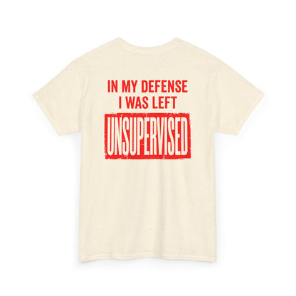 Back Print of a natural T-shirt featuring the bold red and cream quote “In My Defense I Was Left Unsupervised,” a funny back print statement tee with retro typography, sarcastic quote shirt, witty adult humor graphic, dry humor novelty apparel, bold statement t-shirt, and playful sarcasm design for fans of funny quote shirts.

