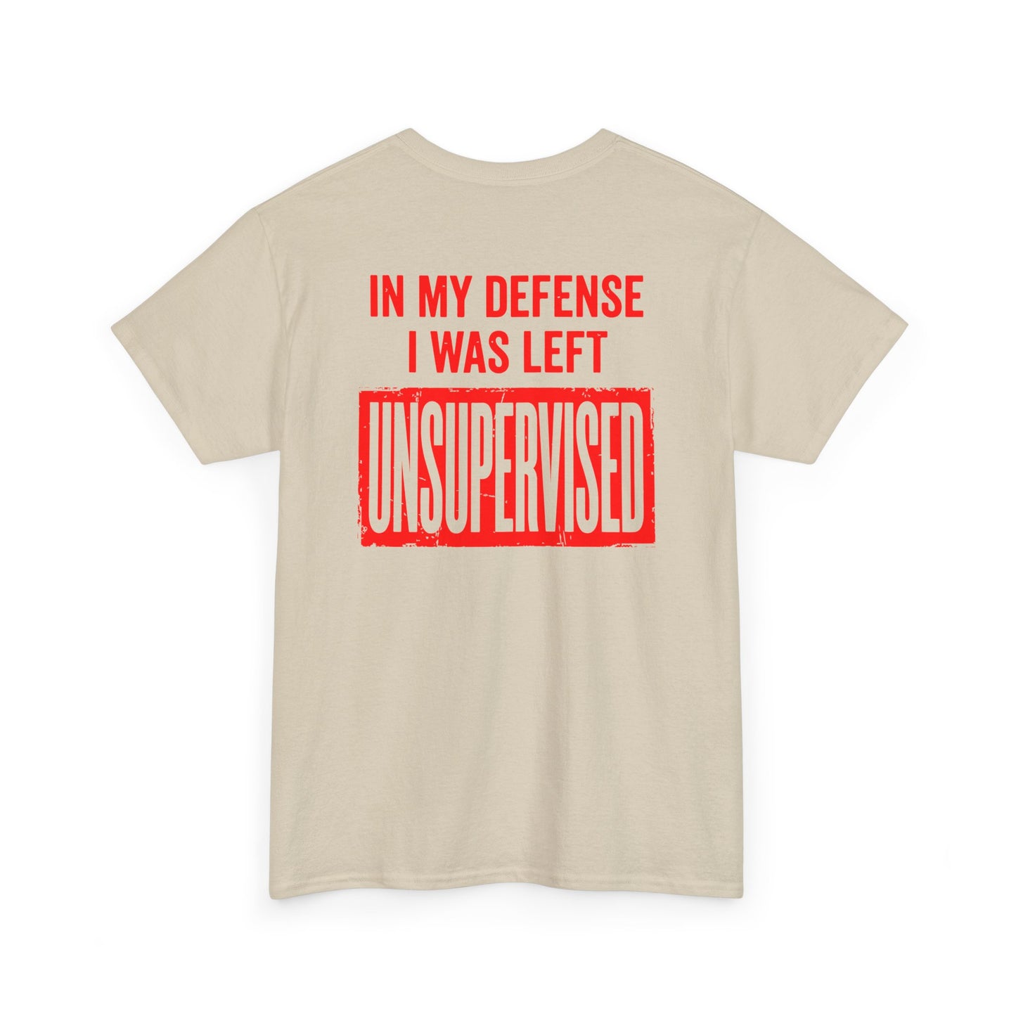 Back Print of a sand T-shirt featuring the bold red and cream quote “In My Defense I Was Left Unsupervised,” a funny back print statement tee with retro typography, sarcastic quote shirt, witty adult humor graphic, dry humor novelty apparel, bold statement t-shirt, and playful sarcasm design for fans of funny quote shirts.

