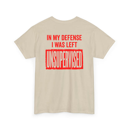 Back Print of a sand T-shirt featuring the bold red and cream quote “In My Defense I Was Left Unsupervised,” a funny back print statement tee with retro typography, sarcastic quote shirt, witty adult humor graphic, dry humor novelty apparel, bold statement t-shirt, and playful sarcasm design for fans of funny quote shirts.

