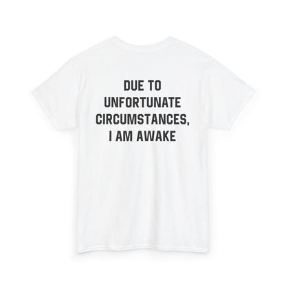 Back Print of a white T-shirt featuring bold black text reading "Due To Unfortunate Circumstances, I Am Awake," funny back print sarcastic quote shirt, not a morning person tee, dry humor graphic shirt, and blunt statement design.
