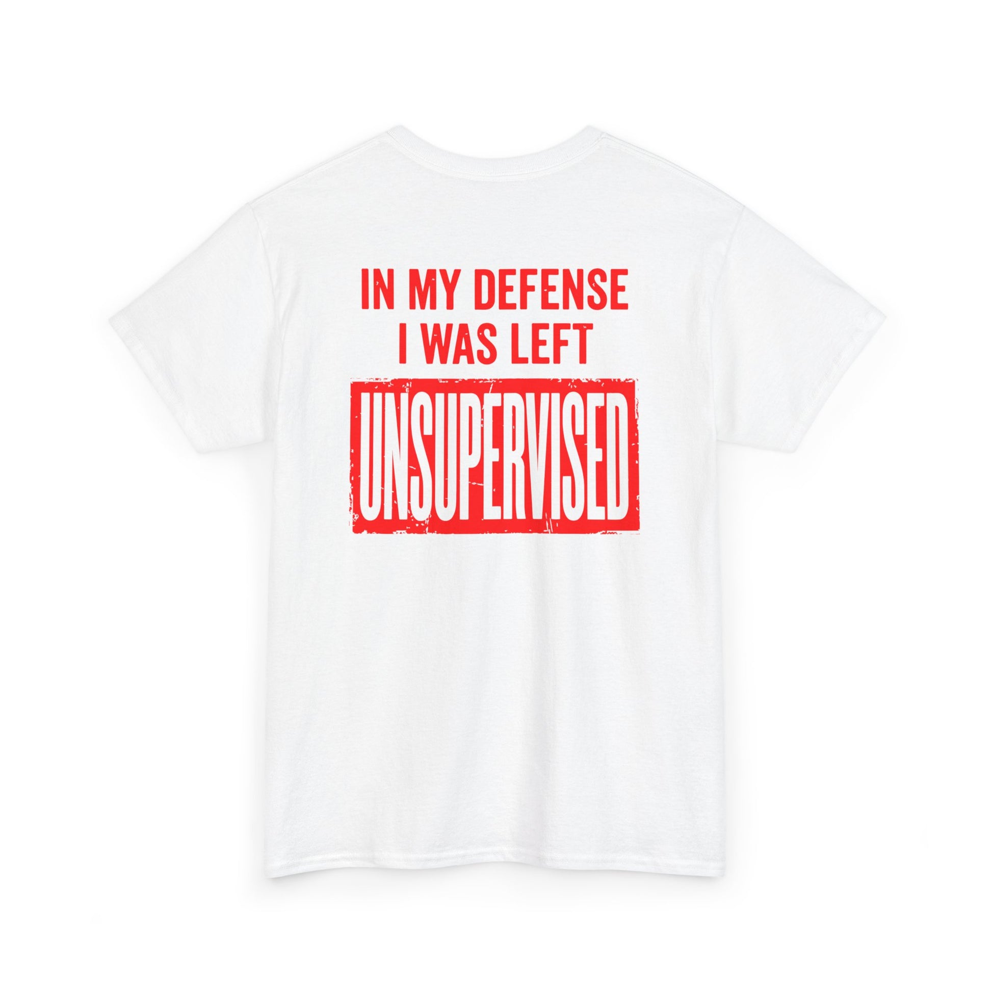 Back Print of a white T-shirt featuring the bold red and cream quote “In My Defense I Was Left Unsupervised,” a funny back print statement tee with retro typography, sarcastic quote shirt, witty adult humor graphic, dry humor novelty apparel, bold statement t-shirt, and playful sarcasm design for fans of funny quote shirts.

