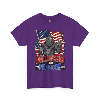 Bigfoot Shirt Squatchin' For Freedom 1776 Patriotic T-shirt Gift | TEEZOCA 4th of July Bigfoot T-shirt showing a Sasquatch with an American flag, freedom lettering, and rugged outdoor style.
