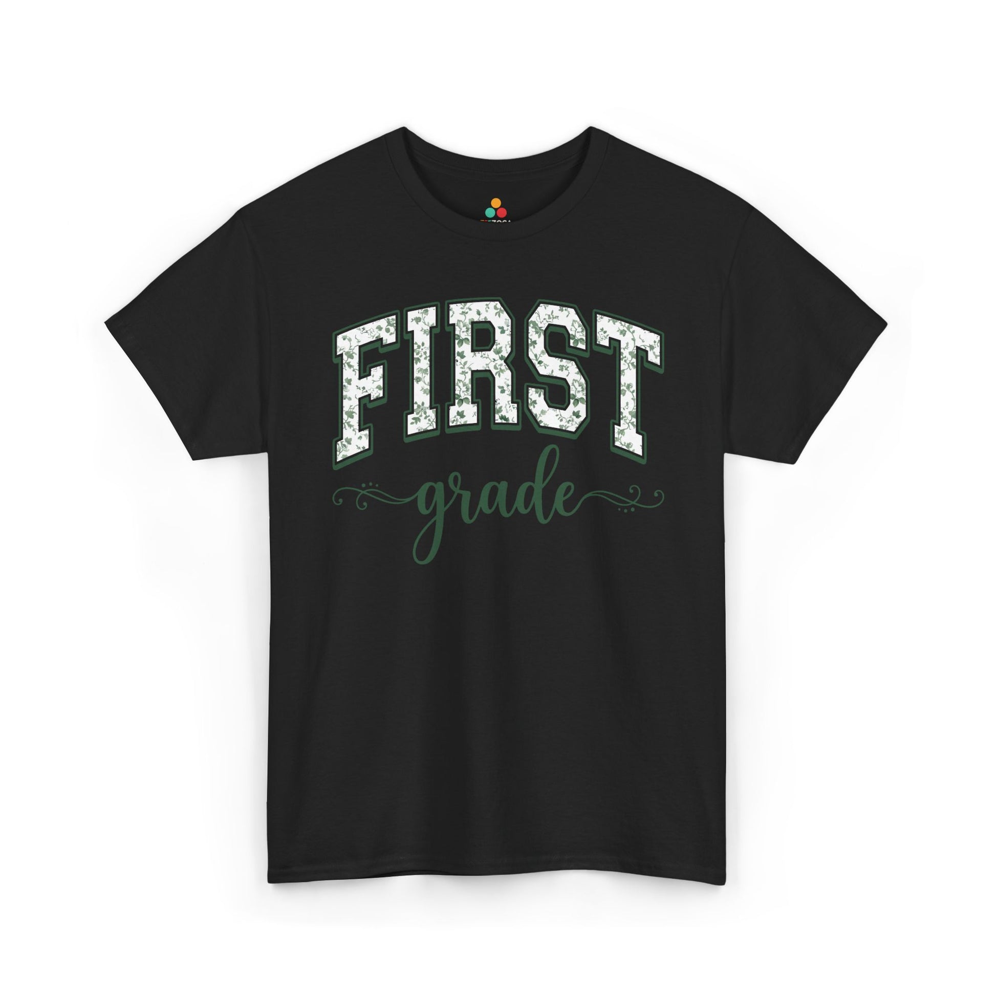 Black t-shirt with 'FIRST grade' text on a white background. TEEZOCA first grade teacher shirt featuring sage floral varsity lettering, a cute back to school tee for teachers.

