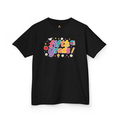 Black t-shirt with 'Fifth Grade!' text and graphics on a white background. Bright TEEZOCA t-shirt featuring Fifth Grade word art, an apple, pencil, books, and a first day of fifth grade shirt look.