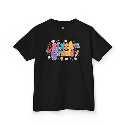 Black t-shirt with 'Sixth Grade!' text and graphics on a white background. Bright TEEZOCA t-shirt featuring Sixth Grade word art, an apple, pencil, books, and a first day of sixth grade shirt look.