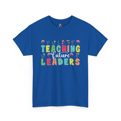 Blue t-shirt with colorful text 'Teaching Future Leaders' on a white background