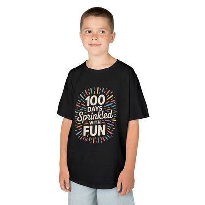 Boy wearing a black TEEZOCA “100 Days Sprinkled With Fun” 100th day of school shirt.