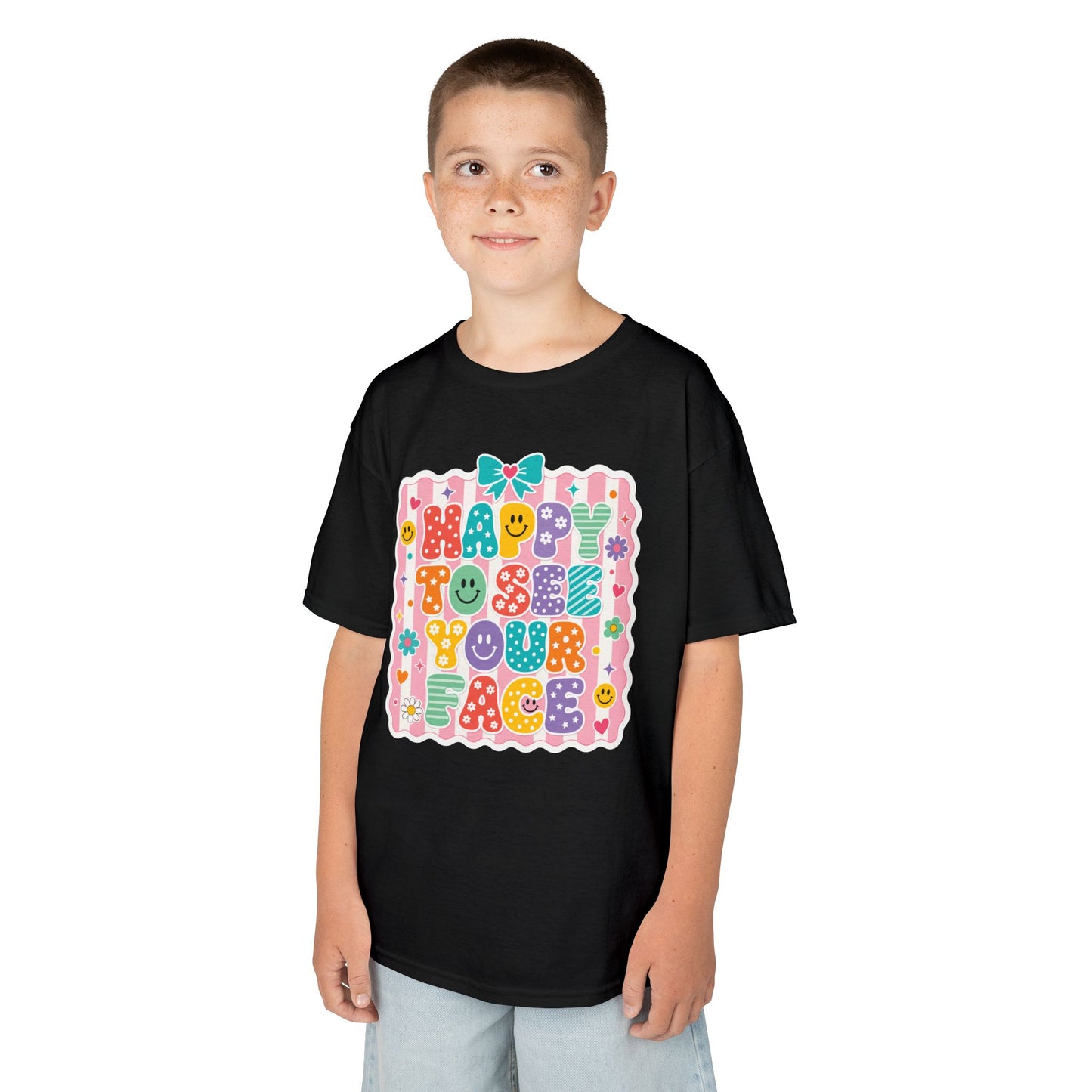 Boy wearing a black TEEZOCA Happy to See Your Face kids t-shirt, a cute back to school shirt for the first day.
