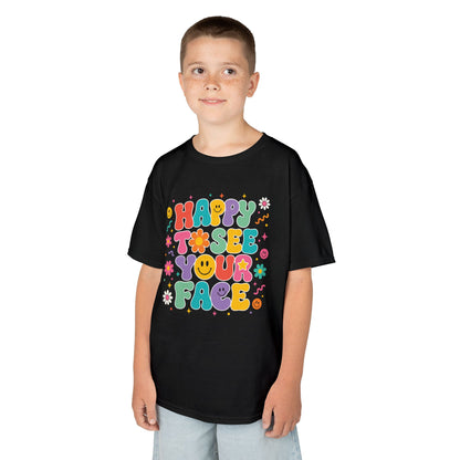 Boy wearing a black TEEZOCA Happy to See Your Face retro kids t-shirt, a cute back to school shirt for the first day.

