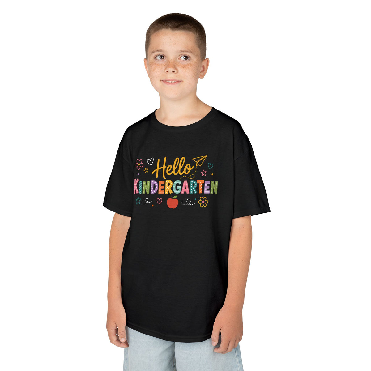 Boy wearing a black TEEZOCA Hello Kindergarten kids t-shirt, a cute back to school shirt for a new kindergartener.
