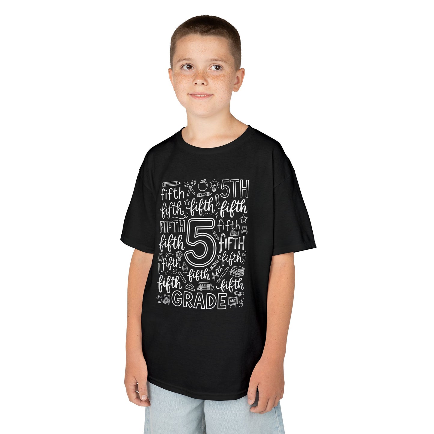 Boy wearing a black TEEZOCA fifth grade typography kids t-shirt, a cute back to school shirt for a new fifth grader.
